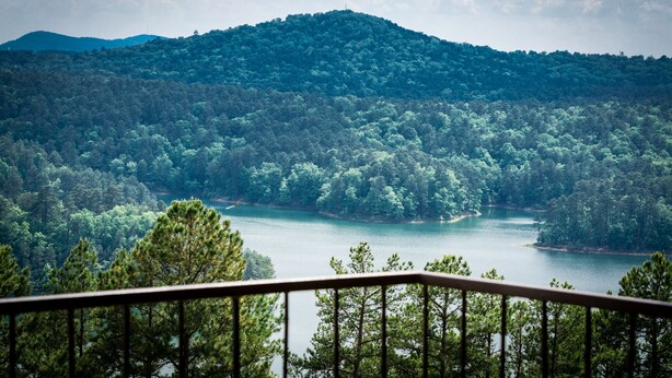 A view of a lake surrounded by dense forest and hills. - Pool Table-Hot springs Village Cozy Twnhse+Walk 2 lake (Hot Springs village)