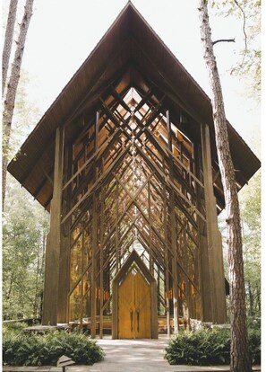 A large wooden structure with a central door, surrounded by trees. - Pool Table-Hot springs Village Cozy Twnhse+Walk 2 lake (Hot Springs village)