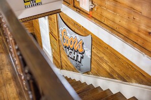 A wooden interior with a sign reading "Coors Light." - Commodore's Compound - One block from Duval St (Key West)