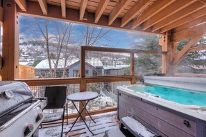 A wooden deck with a hot tub, a grill, and a view of a snowy landscape. - 3BDR Condo in Old Town Walk to Town Lift + Hot Tu (Park City)
