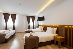 Family Quadruple Room | Minibar, in-room safe, desk, laptop workspace - Castillo Rojo Hotel Istanbul (Istanbul)