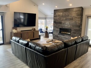 Smart TV, fireplace, books, printers