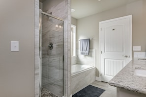 Combined shower/tub, hair dryer, towels, soap