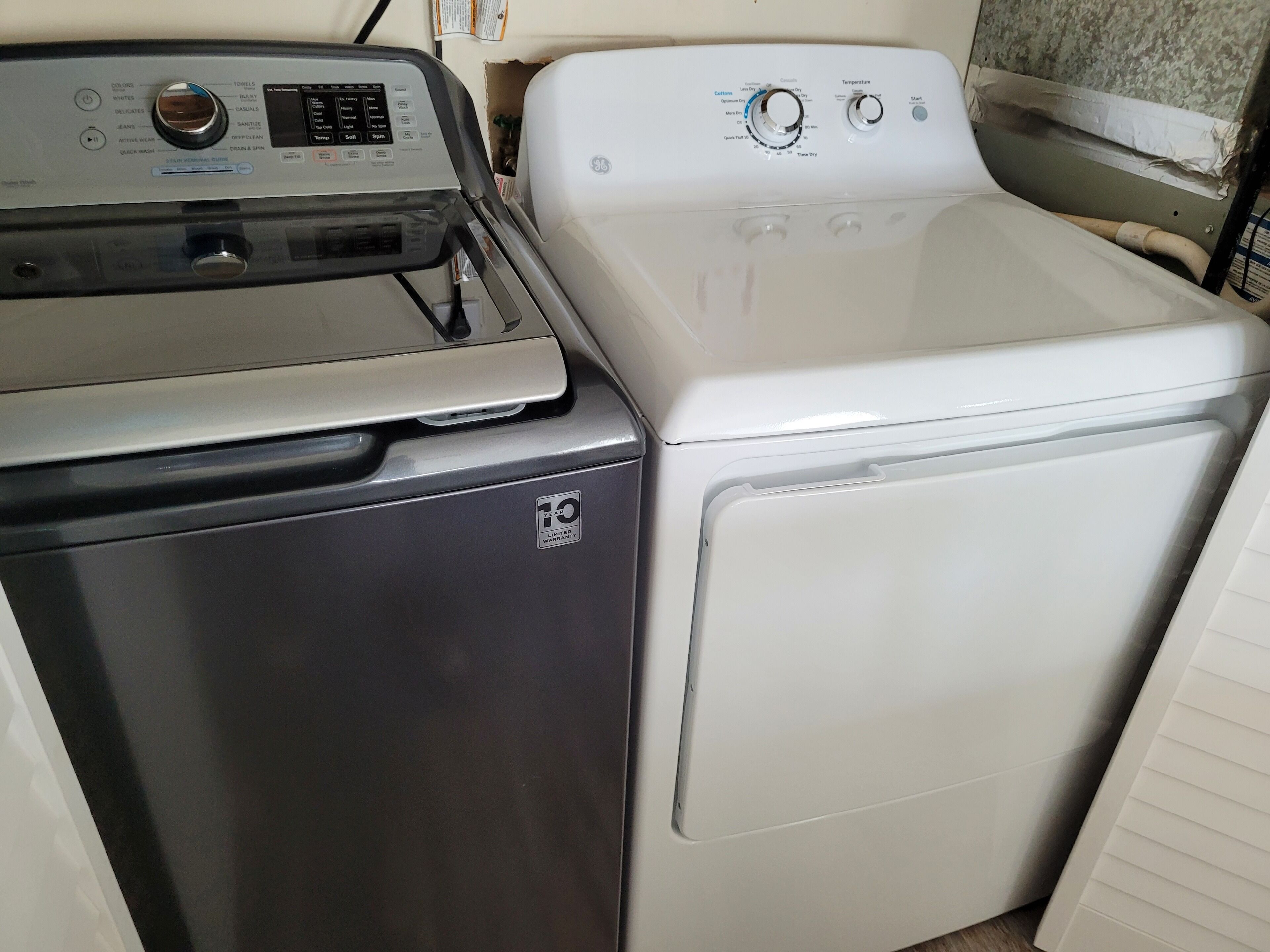 A front-loading washer and dryer side by side in a laundry room.