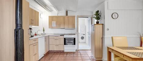 Fridge, stovetop, dishwasher, coffee/tea maker