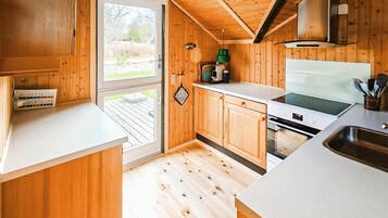 Fridge, stovetop, dishwasher, coffee/tea maker