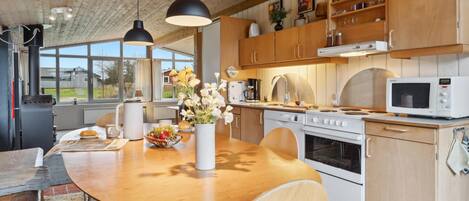 Fridge, stovetop, dishwasher, coffee/tea maker