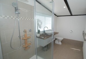 Shower, hair dryer, bathrobes, towels