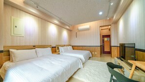 A hotel room with two beds, a TV, and a desk. - Dingai Holiday Museum (Jiaoxi)