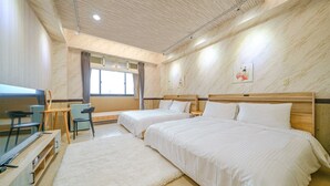 A hotel room with two beds, a desk, chairs, and a large window. - Dingai Holiday Museum (Jiaoxi)