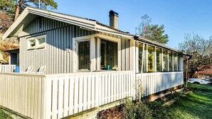 A single-story house with a covered porch, large windows, and a chimney. - 3 bedroom awesome home in Onsala (Onsala)