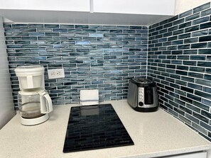 Fridge, microwave, stovetop, coffee/tea maker