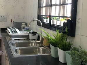 Fridge, microwave, stovetop, coffee/tea maker