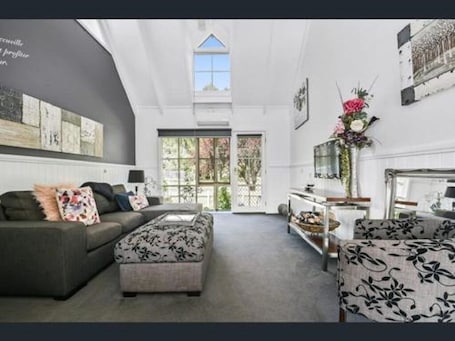 TV. One Bedroom, Two-Storey Apartment