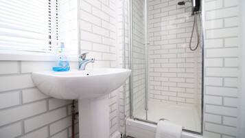 Bathtub, hair dryer, towels