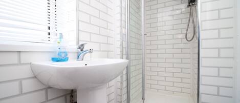 Bathtub, hair dryer, towels