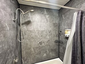 Combined shower/tub, hair dryer, towels, soap