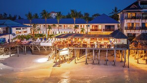 A beachfront resort with a pool area, outdoor seating, and a bar. - Zenobia Beach Resort (Nungwi)
