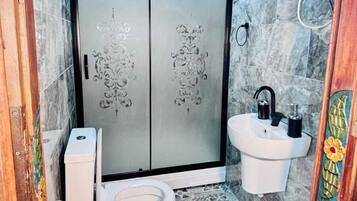 Shower, hair dryer, slippers, towels