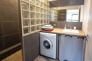 Shower, hair dryer, towels, soap