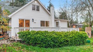 Charming single-story house with a front porch and large window.