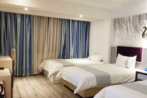A hotel room with two beds, a desk, and a large window with curtains. - Mingdu Holiday Hotel (Xiayi County)