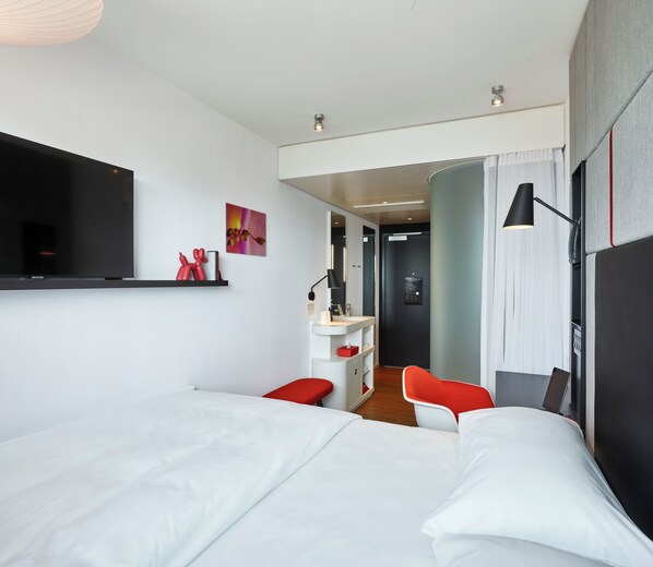 Premium bedding, down comforters, pillowtop beds, in-room safe