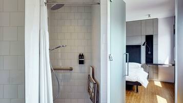 Room, 1 King Bed (Mobility Accessible, Roll-In Shower) | Premium bedding, down duvets, pillow-top beds, in-room safe