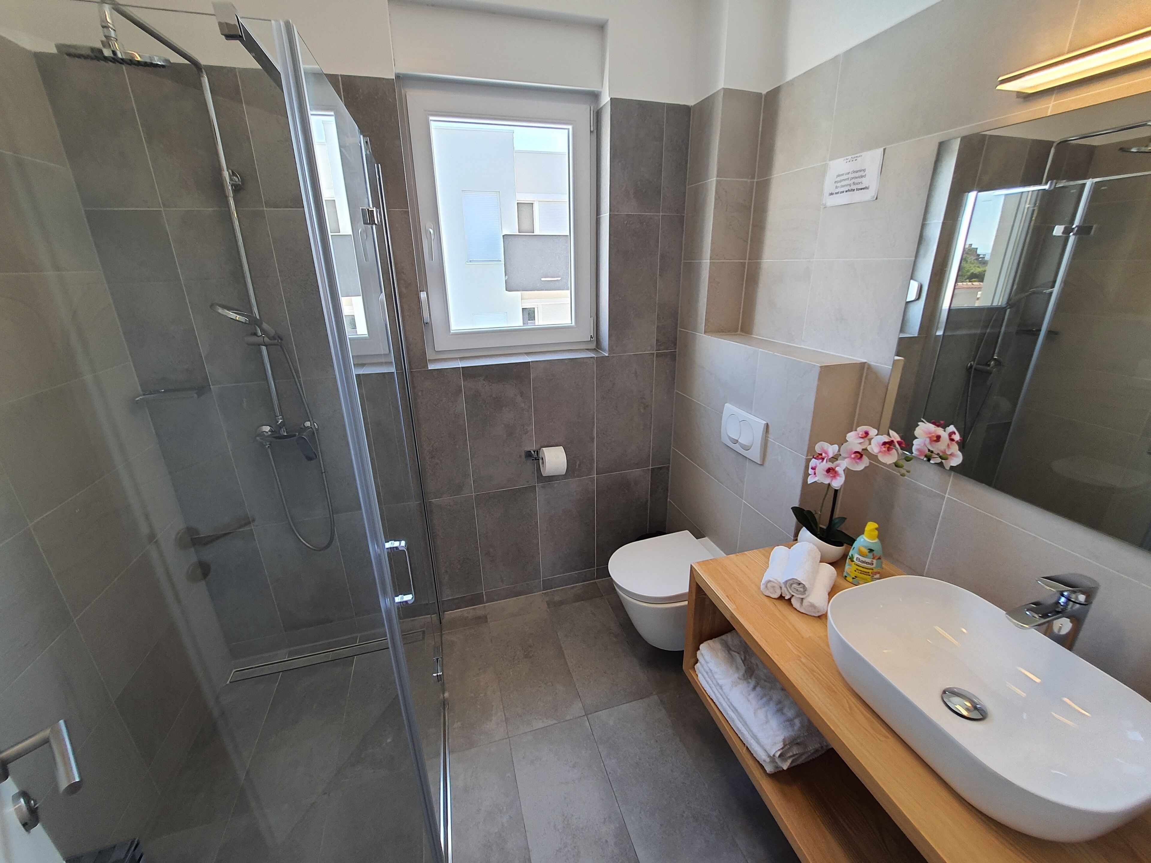 Shower, hair dryer, towels, toilet paper