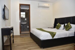 Habitación doble Deluxe | Baño | Regadera y toallas 