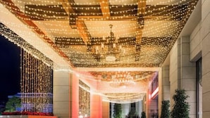 A corridor with a ceiling adorned with string lights and a chandelier. - Yongchang Hotel (Baoshan)