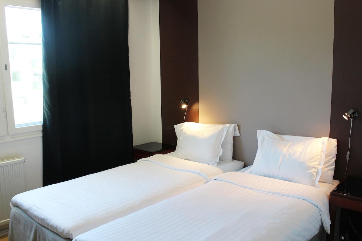 twin room, 2 single beds, garden view | 1 bedroom, in-room safe, laptop workspace, blackout curtains