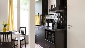 Fridge, microwave, coffee/tea maker, toaster