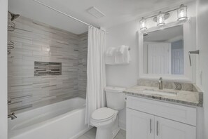 Combined shower/bathtub, hair dryer, towels - Shipwatch 417C by Wild Dunes, Oceanfront Condo (Isle of Palms)