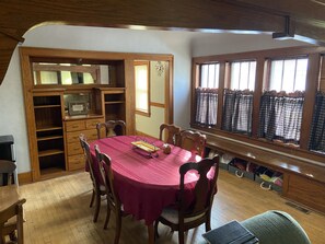 Enjoy meals in this cozy dining area with a round table and comfortable seating for all.