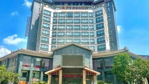A multi-story hotel with a prominent entrance and large windows. - Golden Lusheng International Hotel (Rongshui)