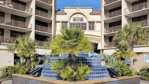 A building with multiple balconies and a sign reading "North Beach Towers". - 5 Star Amenities at North Beach Resort Direct Ocean View Condo,Pools,Hot Tubs (North Myrtle Beach)
