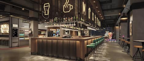 A modern bar area with a wooden bar counter, stools, and a variety of bottles.