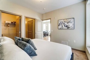 1 bedroom, desk, iron/ironing board, travel crib