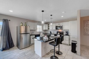 Fridge, coffee/tea maker, high chair, cookware/dishes/utensils - One-Story 3BR N Las Vegas Home • Backyard • Near Strip & Downtown (North Las Vegas)