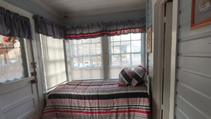 A small, cozy bedroom with a single bed, a radiator, and a window with blinds. - DUPLEX....and yes you get the whole house!!! (Northfork)