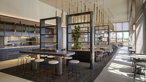 A modern kitchen with bar stools, a central island, and pendant lighting. - Hyatt Place Melbourne, Caribbean Park (Scoresby)