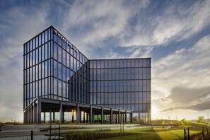 A modern hotel with a glass facade and a prominent 'Hyatt Place' sign. - Hyatt Place Melbourne, Caribbean Park (Scoresby)