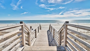 A wooden boardwalk leading to a beach with a clear sky. - Labor Day Is Available Breathe Taking North Beach Resort Ocean Front Condo (North Myrtle Beach)