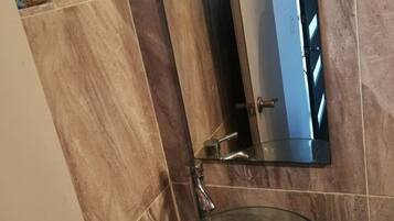 Shower, towels, soap, toilet paper