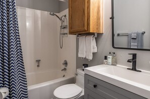 Combined shower/bathtub, hair dryer, towels, soap