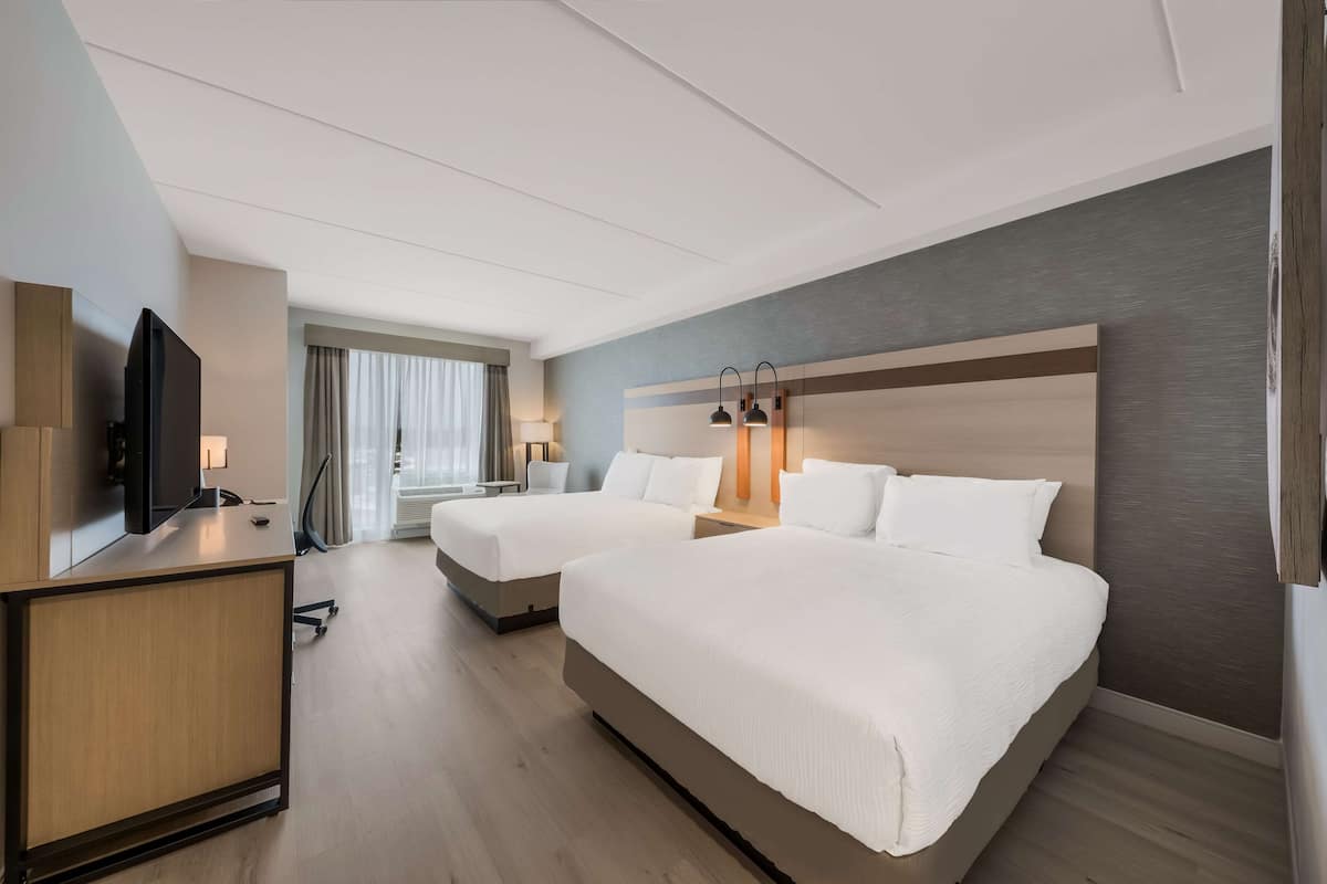 Standaard kamer, 2 queensize bedden, toegankelijk voor mindervaliden, koelkast & magnetron | 1 slaapkamer, hypoallergeen beddengoed, een kluis op de kamer