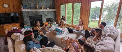 Smart TV, fireplace, books, video library