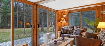 Lakefront Home with a Private Dock, Deck, Fireplace, Spacious Yard, & Playset