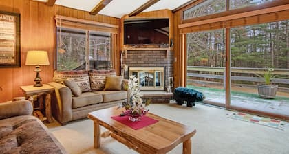 Lakefront Home with a Private Dock, Deck, Fireplace, Spacious Yard, & Playset